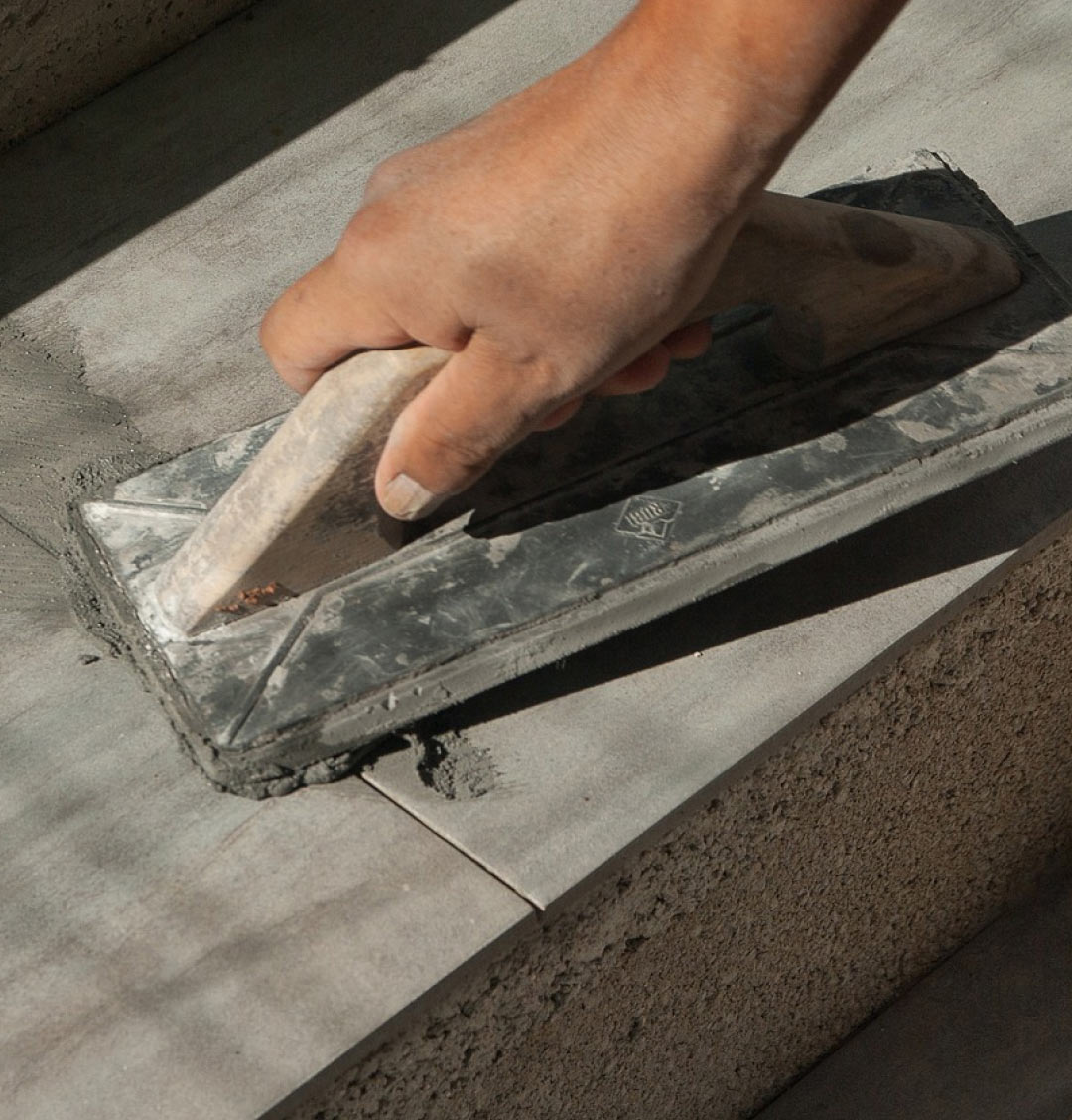 applying grout to tiles