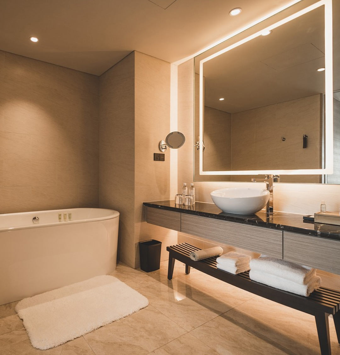 modern bathroom with light bordered mirror